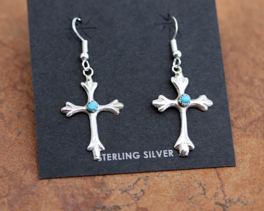 Beautiful Navajo Native American earrings. They are made from sterling silver and turquoise. The earrings are about 1 7/8" in length including the hook and 7/8" wide.

