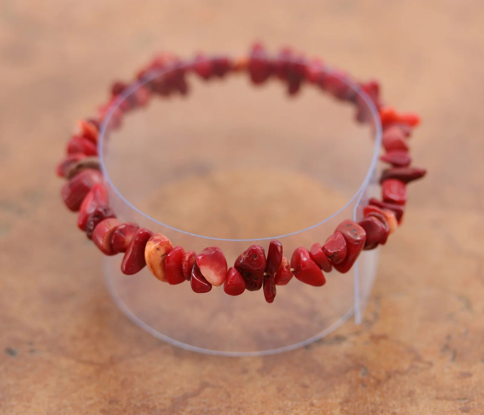 Stretch bracelet with red coral nuggets that vary in shape and size