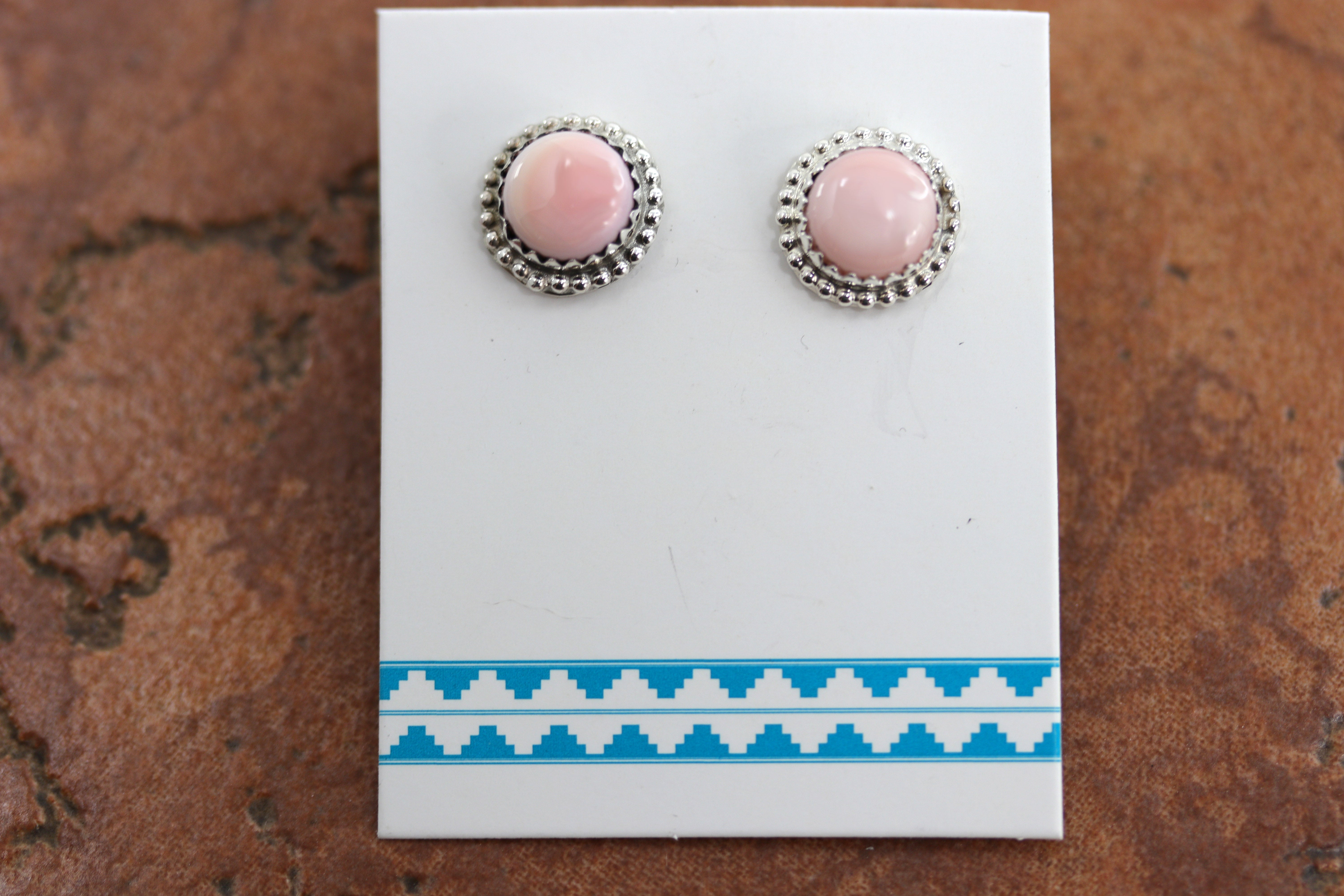 Circular silver stud earrings with pink quartz gemstone earrings