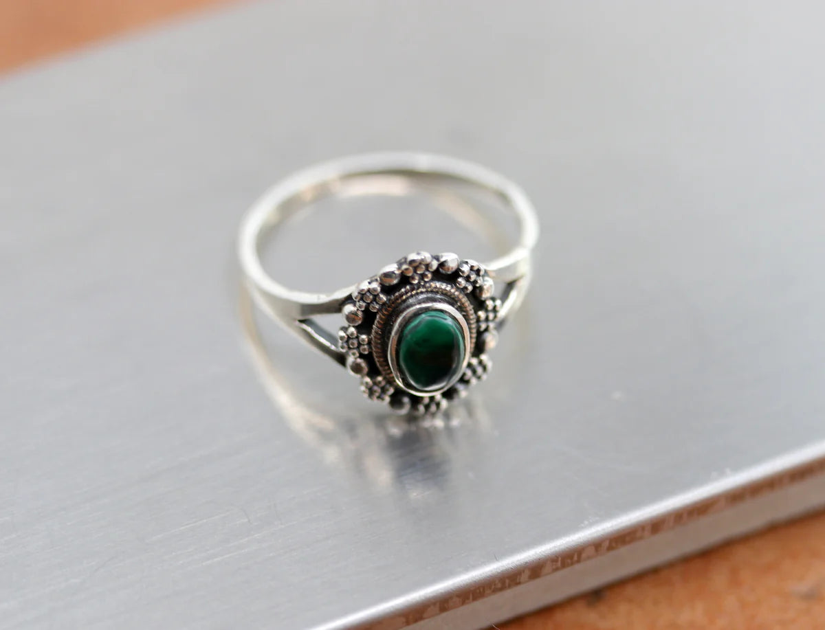 Sterling Silver ring with a circular green gemstone made from malachite