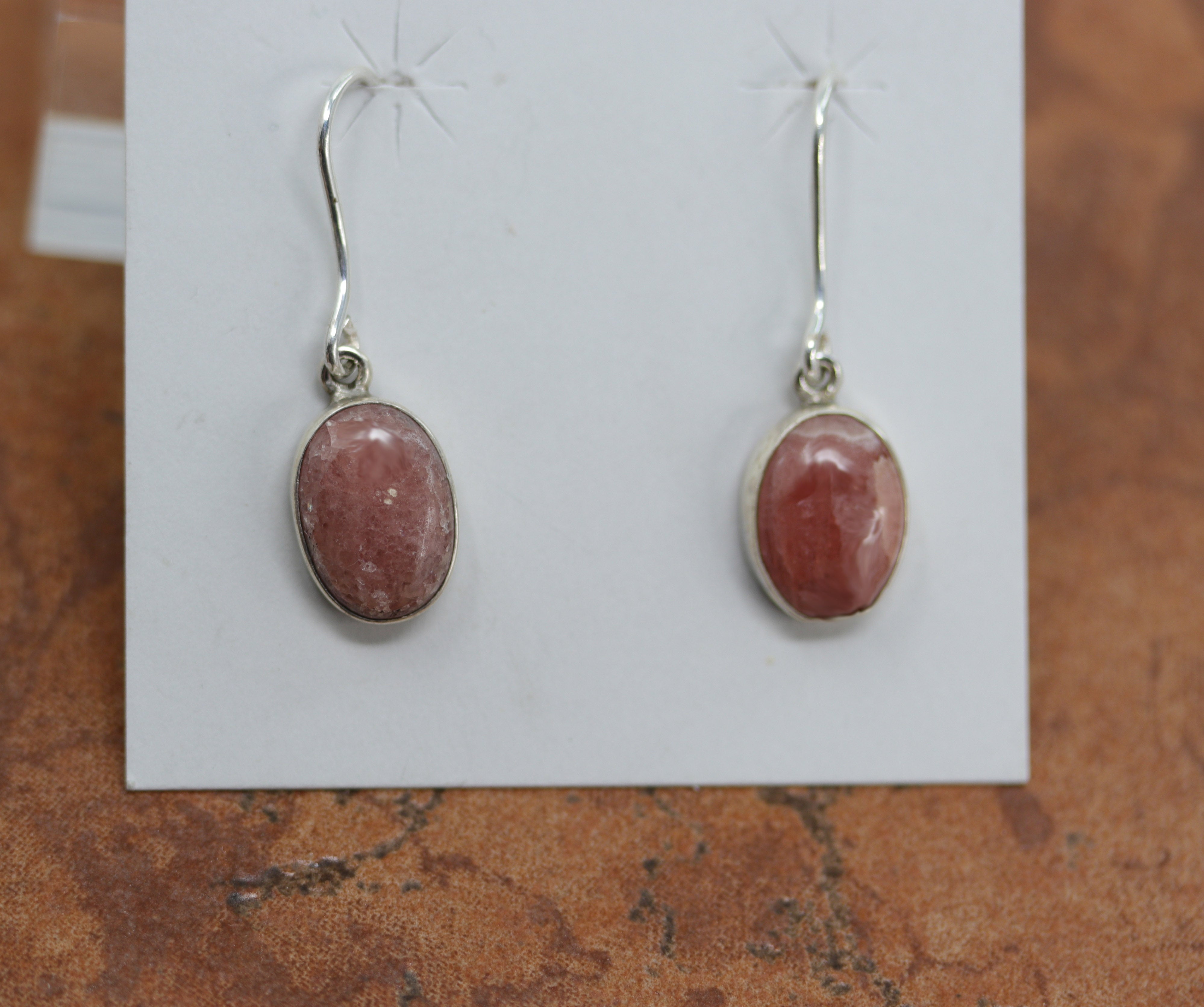Silver earrings made from oval pink quartz gemstones